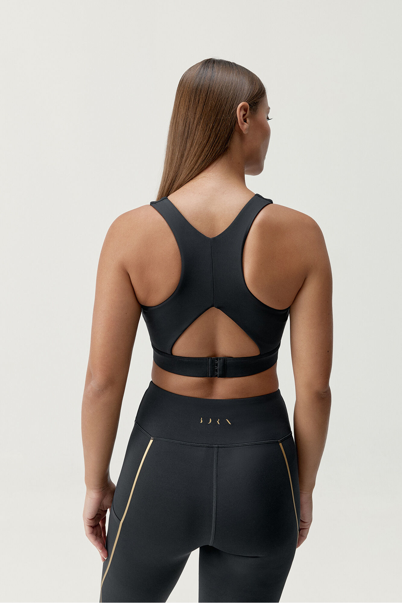 Born Living Yoga Gold Black sports bra top
