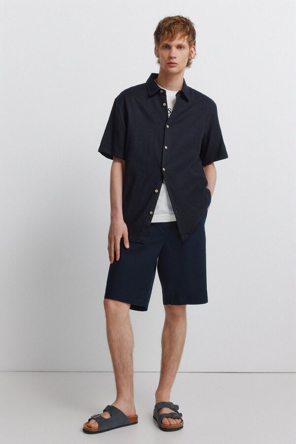 Conjunto de polo e bermudas