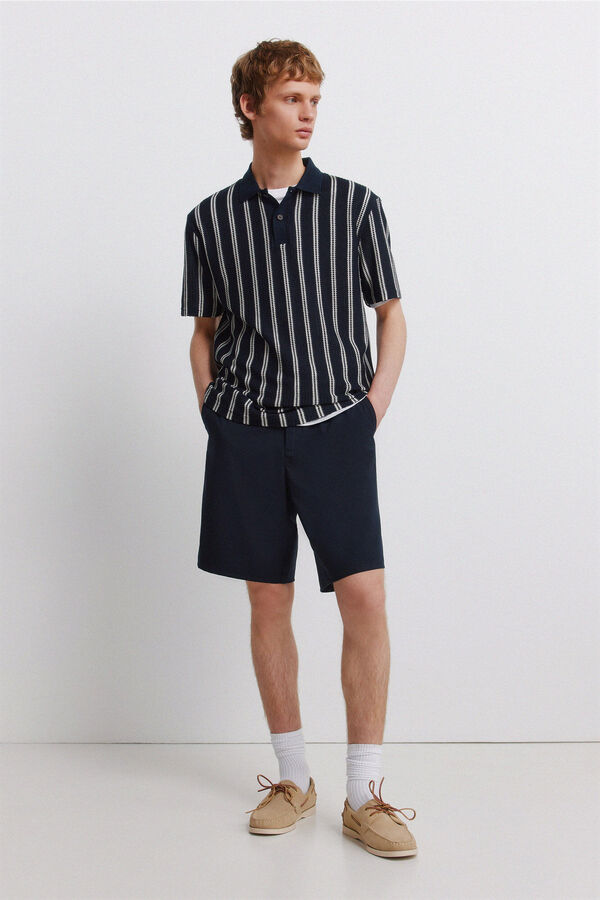 Conjunto de polo e bermudas