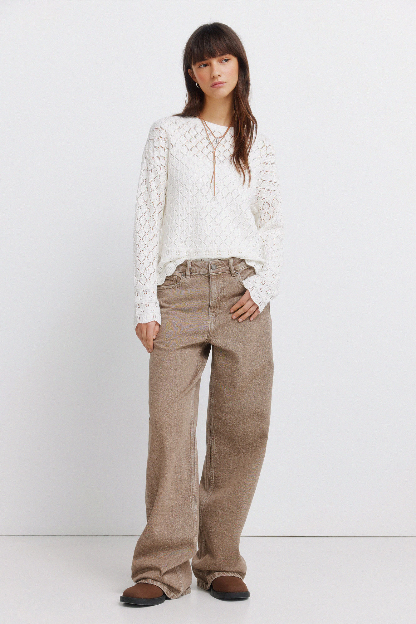 Conjunto de botas, jeans e camisola